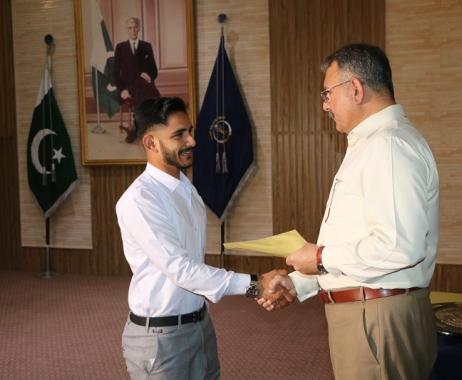 College Principal is awarding to a cadet